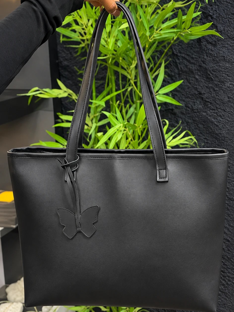 MAEV tote in Graphite, a deep black with a butterfly charm