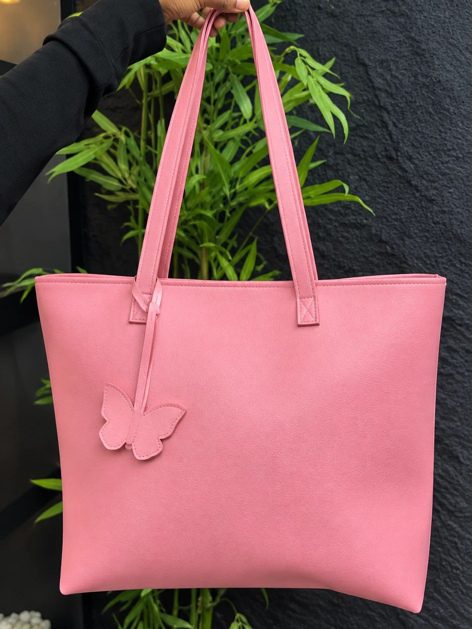 MAEV tote in Rose, a soft warm pink with a butterfly charm