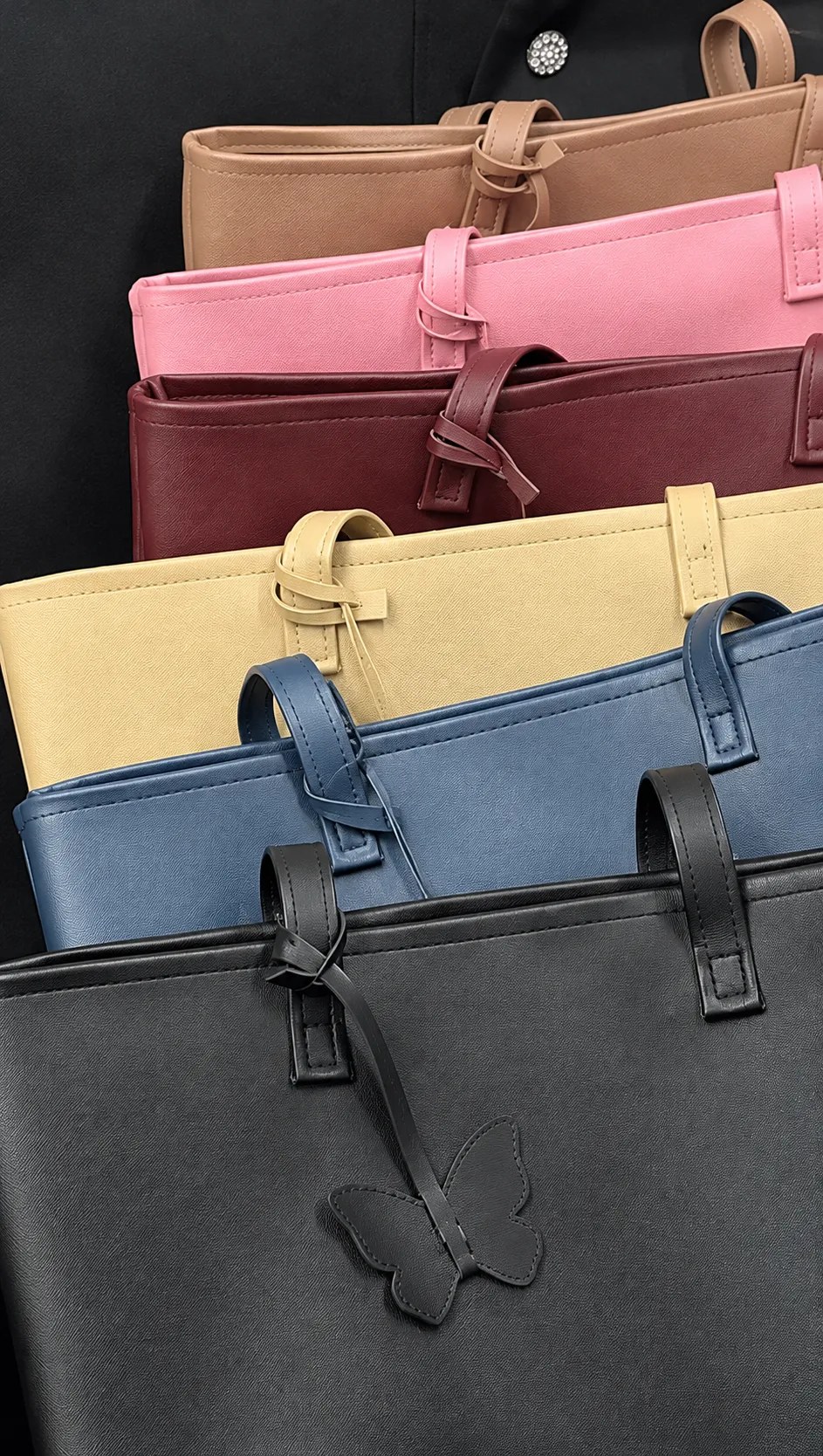 MAEV tote bags in rose, wine, sand, blue and charcoal stacked side by side